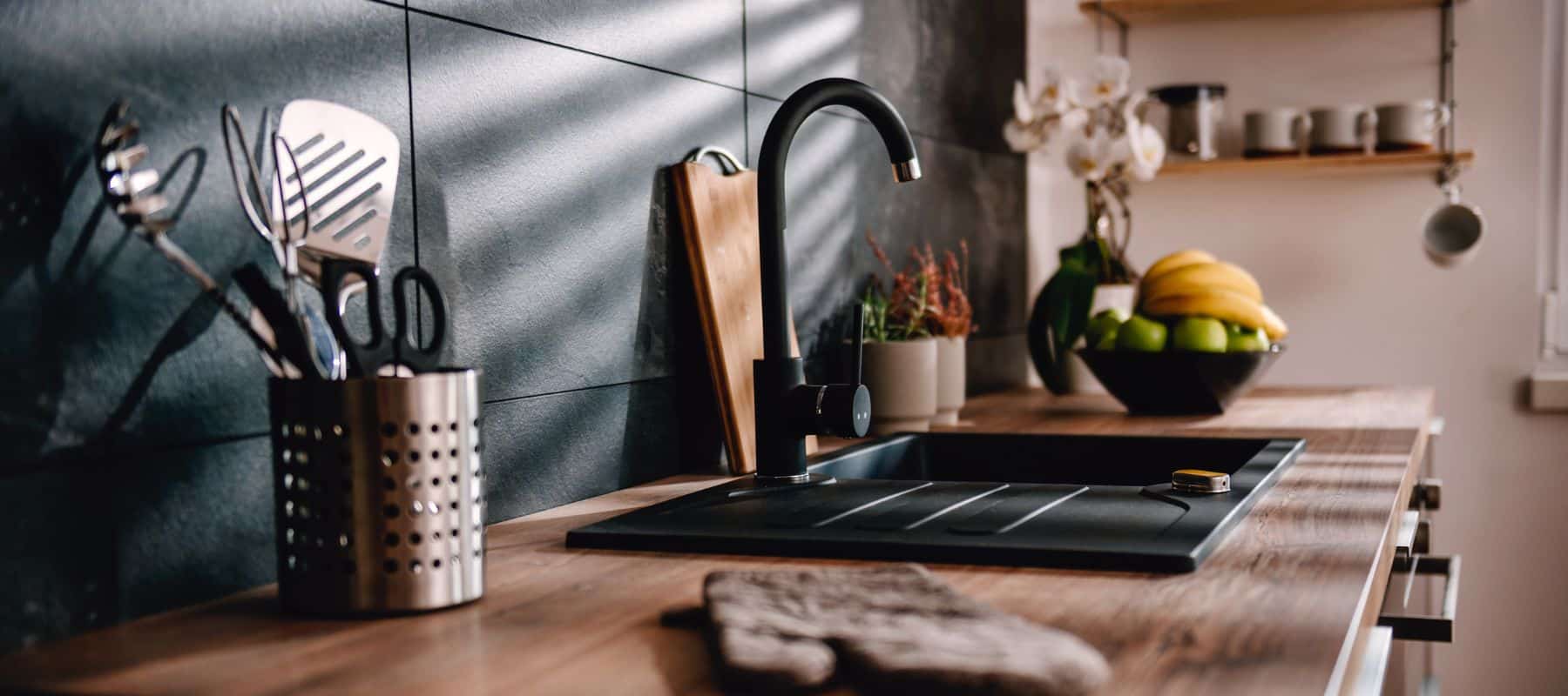 wood kitchen counter with black sink